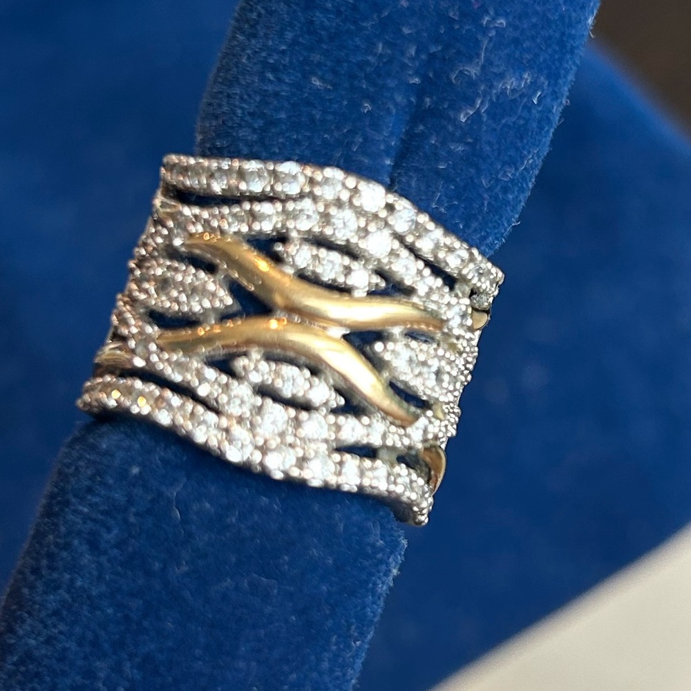 New ring of 925 rhodium-plated sterling silver and 18-carat gold with zircons